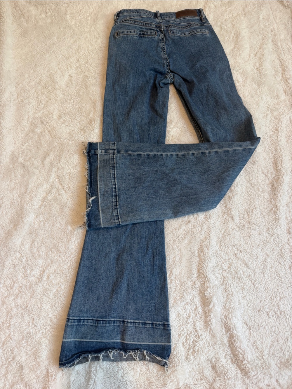 Classic Blue Bootcut Jeans with Raw Hem